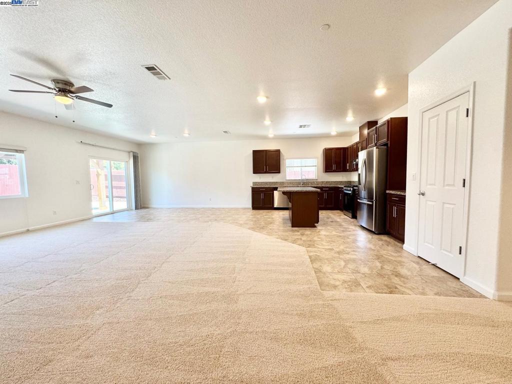 Beautiful Home at a Great Price in a Newer Community! Welcome to this gorgeous, move-in-ready home featuring fresh interior paint and brand new carpet throughout. Located just minutes from top-rated Elementary Schools, Woodward Park, Bass Pro Shops, Walmart, AMC Theatres, Valley Fitness, and an array of restaurants and shops — this home offers both comfort and convenience. Inside, you'll find an open-concept kitchen with a center island, brand new range and hood, and stainless steel appliances included. The bonus room can be used as a home theater, office, or even a 5th bedroom — perfect for your family's needs. The spacious master bedroom and all other rooms include walk-in closets, providing plenty of storage. Other highlights include a Tesla charger, easy access to Hwy 99 and I-5, and a relaxing backyard gazebo for shade and outdoor enjoyment. With parking for up to 4 vehicles in front of the home, this property checks all the boxes. Don’t miss out — come see it today!