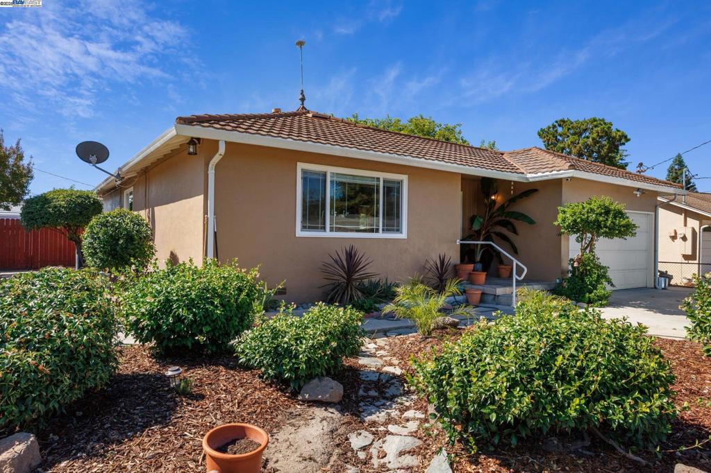 Welcome to 3491 Madeira Way, a charming three-bedroom, one-bath single-family home located in Livermore. This thoughtfully updated home offers approximately 1,038 sq ft of living space on a spacious 5,116 square foot corner lot, with comfortable indoor-outdoor flow. The home features a remodeled kitchen with updated appliances and modern finishes, an upgraded bathroom, and stylish new tile flooring. Three well-sized bedrooms offer ample natural light and storage, while an attached two-car garage doubles as a workshop enthusiast’s dream—complete with built-in workbench, air compressor, and air tools included. Outside, the fenced yard includes mature landscaping, two sheds for workspace or storage, side access with room to explore ADU potential, and a relaxing hot tub that stays. Located just minutes from Livermore’s thriving downtown, this home sits in a community that has transformed from a rural pass-through into one of the East Bay’s most dynamic and culturally rich cities. Residents enjoy walkable access to parks, top-rated schools, and vibrant retail and dining destinations along First Street and Railroad Avenue. A property in one of Livermore’s most established residential pockets. Photos include virtually staged and digially enhanced. Original photos are included too.