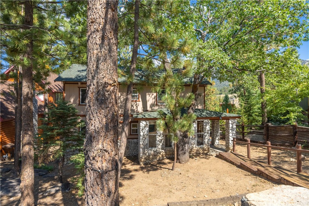 Welcome to your perfect mountain retreat at 1217 Aspen Drive in Big Bear Lake, CA! This charming home offers a cozy and relaxed vibe, great for escaping the hustle and bustle. With 3 bedrooms and 2 bathrooms spread over 1,728 square feet, there's room for everyone to spread out and enjoy. Imagine sipping your morning coffee on one of the two spacious decks while soaking in the breathtaking ski slope views. Located just a leisurely stroll from Bear Mountain, adventure awaits right at your doorstep. Whether you're warming up by one of the two fireplaces on a chilly evening or cooking up a storm in the upgraded kitchen, this home is sure to charm you. The large fenced yard is great for gatherings, BBQs, or simply enjoying some peace and quiet surrounded by nature. The dining room provides a great space for entertaining or enjoying family meals. This versatile home is a fantastic option whether you're seeking a vacation rental, a second home, or a full-time residence. Its unique features and prime location offer endless possibilities for enjoyment and relaxation. Don't miss your chance to own a piece of Big Bear Lake paradise! For more details or to schedule a viewing, reach out today and start your next adventure in this delightful home