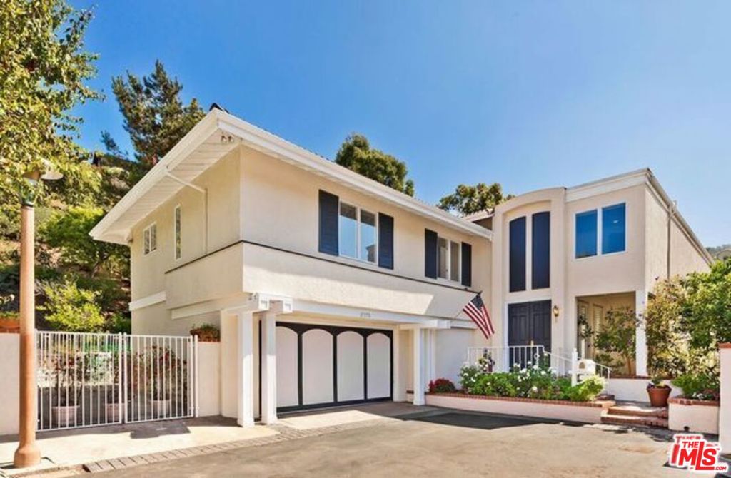 Come home to this stunning 5 bedroom 6 bath resort style home with scenic mountain views nestled at the end of a beautifully manicured cul de sac in the highly desirable Palisades Highlands location. Enter to dramatic soaring ceilings and French doors looking out on a private hill side, citrus trees and a lovely rose garden walkway. Hardwood flooring throughout the first floor foyer, family room and chef's kitchen with granite countertops, stainless steel appliances, double oven. Other built ins include a custom wine closet for the wine lovers and a media closet in the living room. Downstairs office could be used as a maid's quarters. Great home for a large family as all of the bedrooms are large with their own private bathrooms. Large primary suite with his and hers walk in closet, vanity and plantation shutters overlooks private hillside.