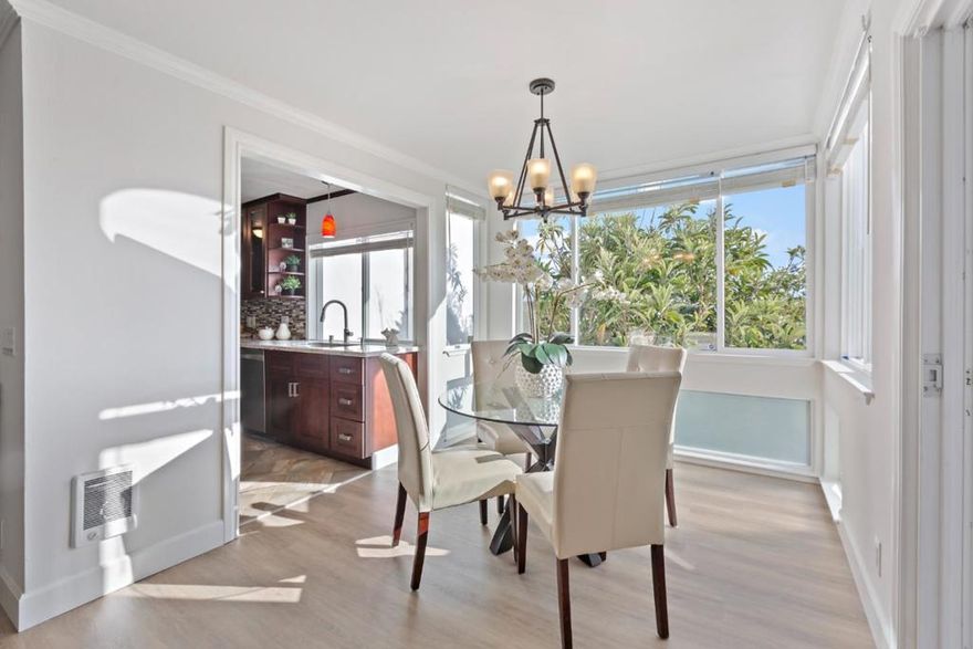 Bright corner condo, tucked away in the quiet back of the desirable Sand Harbor north community. South facing windows and private courtyard view. The home feels open and airy all day long. Enjoy luxury vinyl plank floors, recessed lighting and modern fully renovated kitchen with rich cherry-shaker cabinetry, granite counters, designer tile backsplash, stainless appliances and a deep single bowl sink perfect for home chefs. Both bathrooms have been beautifully updated. The primary suite includes a generous walk-in closet with custom shelving and an ensuite bath. A separate laundry room and abundant storage add convenience.  Living room with fireplace. Sand Harbor residents enjoy lush landscaping, community pool, clubhouse, and trails nearby. Catamaran Park across the street, stroll to the lagoon, playgrounds and top-rated schools Foster City schools. With one assigned parking space and close to Highways 92 & 101, this move-in ready condo offers the best of bay-side living. HOA fee is $750 covers water, insurance, exterior maintenance and pool. Built 1972.