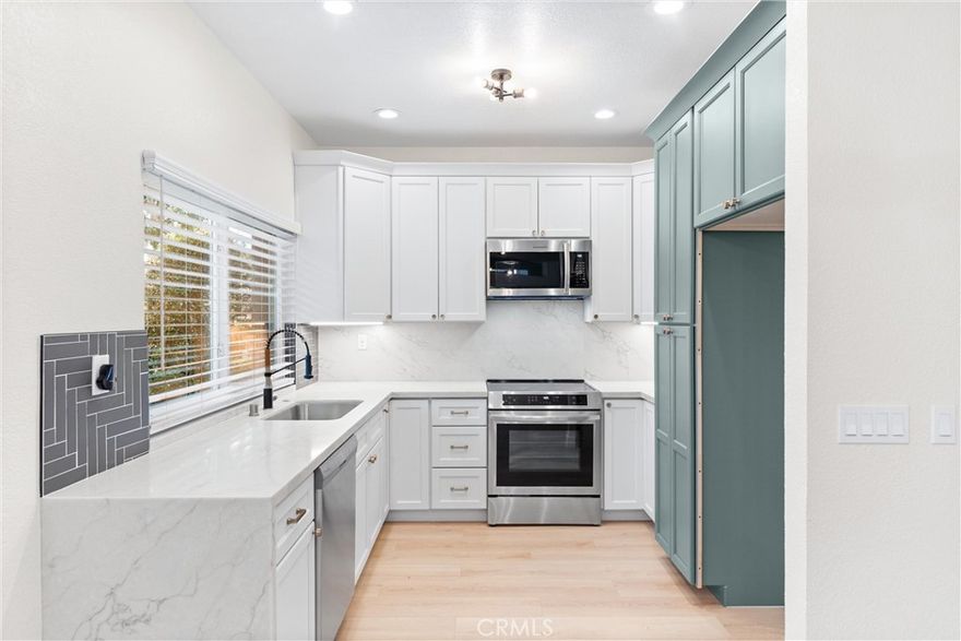 Welcome to this beautifully renovated single-level home in the heart of Dana Point! This 2 bed, 2 bath residence offers modern comfort and coastal charm in an unbeatable location. The home features a fully renovated kitchen with quartz countertops, shaker cabinetry, and brand new stainless steel appliances. It also boasts two completely renovated bathrooms, new luxury vinyl flooring, and fresh interior paint throughout. The open-concept living area includes a cozy fireplace and access to a private covered patio, perfect for relaxing or entertaining. Enjoy the convenience of an indoor laundry room (washer and dryer included) and direct access to the attached garage. Central heating and air conditioning ensures year round comfort, and the community pool is just steps away. Ideally situated within walking distance to the Ocean Ranch Village shopping center, this home offers the perfect blend of convenience and coastal living. And just 5 minutes to Dana Point’s beautiful beaches!