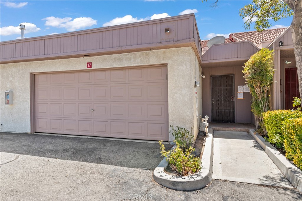 This Vera two-story townhome is located in a private gated community and offers 3 bedrooms, 2 full baths, and 1,496 sq. ft. of living space. The floor plan features a bright living and dining area that opens to a private atrium with multiple sliding glass doors. The kitchen includes quartz counters and white cabinetry. The upstairs primary suite offers vaulted ceilings, a walk-in closet, private bath, and a balcony overlooking the landscaped grounds. A spacious loft provides additional living space, while two downstairs bedrooms open to a private patio. Additional highlights include a one garage with direct access and laundry hookups. Community amenities include two pools, two spas, greenbelts, gazebos, and a rose garden. Conveniently located near schools, public parks, and shopping.