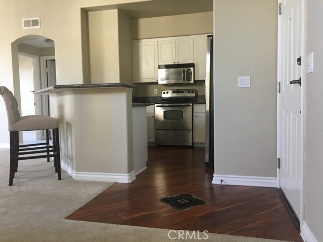 Highly desirable corner unit on top floor with high ceilings and pool view. This beautiful space has a den that can be used as an extra bedroom or office.
Unit includes:
2 reserved indoor parking spaces
Walk-in master closet
Private balcony (with storage closet)
Washer & Dryer
Central heating & air
Granite countertops
Stainless steel appliances
Crown molding & baseboard
Gas fireplace
Tile floor in bath, wood floor in kitchen
Building complex features include:
On-site concierge & security
24-hour fitness center
Sports club with pool table, bar, and 5 large TV screens on digital satellite
24-hr business center
Conference room facilities
Stadium-style movie theater
Large gourmet kitchen & dining room for your special occasions
Community activities such as: cooking classes, yoga, pilates, etc.
Tropical landscaping
Picturesque courtyards
Beautifully furnished cabanas surrounding two resort-like pools, tiki bars & BBQs
Library with piano
***If interested, please email a brief intro about yourself and/or people interested in renting. Agent will not respond to inquiries without an intro.