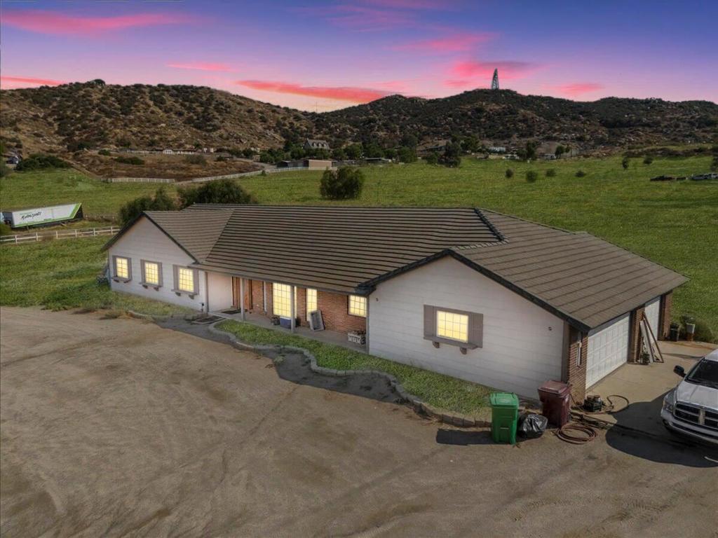 Make your move today and start living your dream of tranquility on 2.06 acres in the heart of Nuevo, CA, just minutes from the scenic Lake Perris State Recreation Area! This charming 4-bedroom, 2-bathroom home is bursting with potential, whether you're looking to move in, add to your investment portfolio, or take on a rewarding fix-and-flip project. Step inside to discover natural wood beams and ceilings that create a cozy, rustic atmosphere. The open main living area is bathed in natural light, making the space feel warm and inviting. With both a spacious family room and a great room, there's plenty of space for entertaining, relaxing, or customizing to suit your lifestyle. The expansive lot offers endless opportunities for expansion, landscaping, or even building additional structures. Imagine a backyard retreat where you can soak in the serene surroundings or develop a space for hobbies and projects. The possibilities are truly limitless! Whether you're a first-time homebuyer or a seasoned investor, this property is a golden opportunity to turn your dreams into reality. Don't miss your chance to make this versatile space your own! Schedule a tour today and see the potential for yourself! This gem won't stay on the market for long!