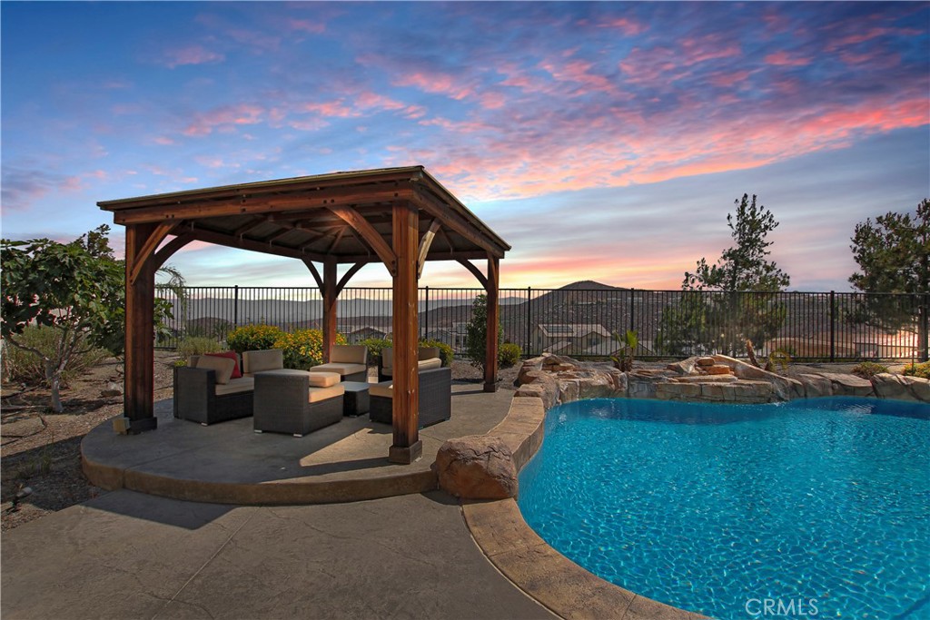 Welcome to 13122 Capricornio Street, a beautifully maintained residence nestled in a tranquil Riverside neighborhood. This exceptional property offers versatility, comfort, and impressive amenities for multi-generational living or potential rental income. The main home features 5 spacious bedrooms and 3-1/4 bathrooms with an open-concept layout that flows seamlessly from the updated kitchen to the light-filled living and dining areas—perfect for both daily living and entertaining.
A standout feature of this home is the attached 2-bedroom Next-Gen suite with its own private entrance, full kitchen, living area, and bathroom—ideal for extended family, guests, or independent living arrangements.
Step outside to a backyard designed for enjoyment and relaxation, where you'll find a sparkling pool with it's own solar heating, covered patio, large pergola, and beautifully maintained landscaping. Enjoy serene panoramic views of the surrounding hills and city lights, offering a peaceful backdrop to your outdoor gatherings.
Located near parks, schools, and shopping, this property combines thoughtful design, energy-efficient upgrades, and flexibility to accommodate a variety of lifestyles—all in one of Riverside’s desirable communities.