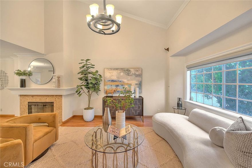 Discover the perfect blend of comfort, convenience, and modern living in this meticulously maintained luxury townhome, ideally situated in the heart of North Alhambra. Boasting a total of 2,154 square feet, including a 282 sq ft bonus room, this spacious residence offers a quiet retreat just moments away from restaurants, shops, 99 Ranch Market and the Huntington Library. Step into the expansive living room featuring soaring ceilings, a cozy fireplace, and an open-concept layout that flows seamlessly into the dining area—perfect for entertaining or relaxing evenings at home. A separate den near the entry offers flexibility as a home office or potential fourth bedroom. The tastefully updated kitchen features custom cabinetry, granite countertops, a charming garden window, and a breakfast bar that opens to a bright and inviting family room, ideal for casual gatherings. A convenient guest powder room and laundry closet completes the main floor.  Upstairs, you’ll find a spacious primary suite complete with a walk-in closet, vanity area, and tranquil ensuite bath. Two additional bedrooms share a well-appointed hall bathroom with a tub and shower combo.  The home’s hidden gem is the oversized bonus room adjacent to the attached two-car garage—a versatile space perfect for a home gym, studio, or additional family room. Enjoy low-maintenance living in a prime location with the luxury of space, thoughtful updates, low monthly HOA and proximity to all that Alhambra has to offer.