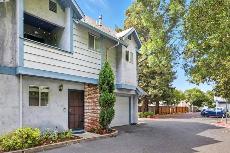 Tucked in the “Heart of the Bay,” this lovingly maintained townhome rests in the highly sought-after Tennyson community of Central Hayward. Thoughtfully cared for, this inviting two-story home offers over 1,000 sqft of comfortable living space designed with both style and ease in mind. Each of the two spacious master suites features its own private bathroom, making it perfect for everyday living or hosting guests.  The home has been cherished and updated with details such as newer flooring and a sliding glass door that opens to the peaceful back patio. Upstairs, both bedrooms offer serene views of the backyard with no rear neighbors, ensuring privacy and tranquility. One suite even enjoys a covered balcony, ideal for quiet mornings with coffee. Additional features include central heating, and an attached one-car garage with extra storage.  The secluded, low-maintenance yard has been thoughtfully arranged for private seating and easy entertaining. All of this in a prime location near I-880, Mission Blvd, BART, and major Bay Area employers—just minutes from local restaurants, shops, golf courses, parks, and trails.