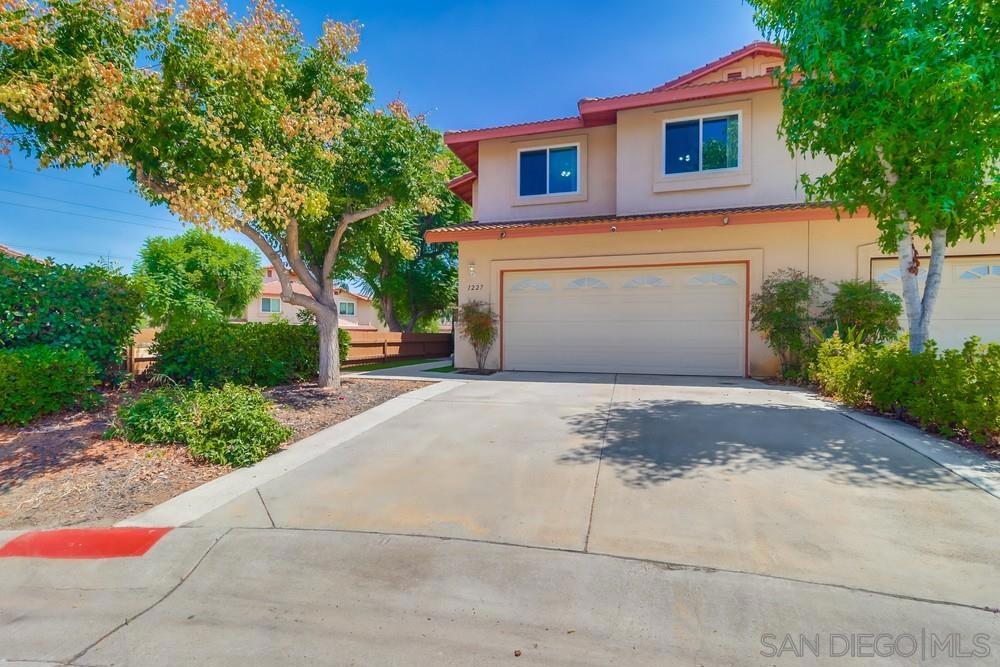 Welcome to 1227 Winter View Place, a beautifully updated 3-bedroom, 2.5-bathroom twinhome located in the desirable Winter View Community of El Cajon. This move-in ready home features 1,418 square feet of stylish living space, freshly painted interiors and exteriors, plush carpeting, and new vinyl plank flooring downstairs. The kitchen is enhanced with sleek granite countertops, offering both beauty and functionality. Each of the three spacious bedrooms includes its own walk-in closet—perfect for families or anyone in need of extra storage. The primary suite also boasts a generous layout, making it a true retreat. Step outside to a low-maintenance backyard featuring fresh turf, custom planters, and a cozy outdoor fireplace—an ideal setup for entertaining or enjoying quiet evenings at home. Built in 2004 and offers an attached two-car garage. Conveniently located near shopping, restaurants, and with easy access to Highways 8 and 67, this home delivers comfort, style, and convenience in one exceptional package.