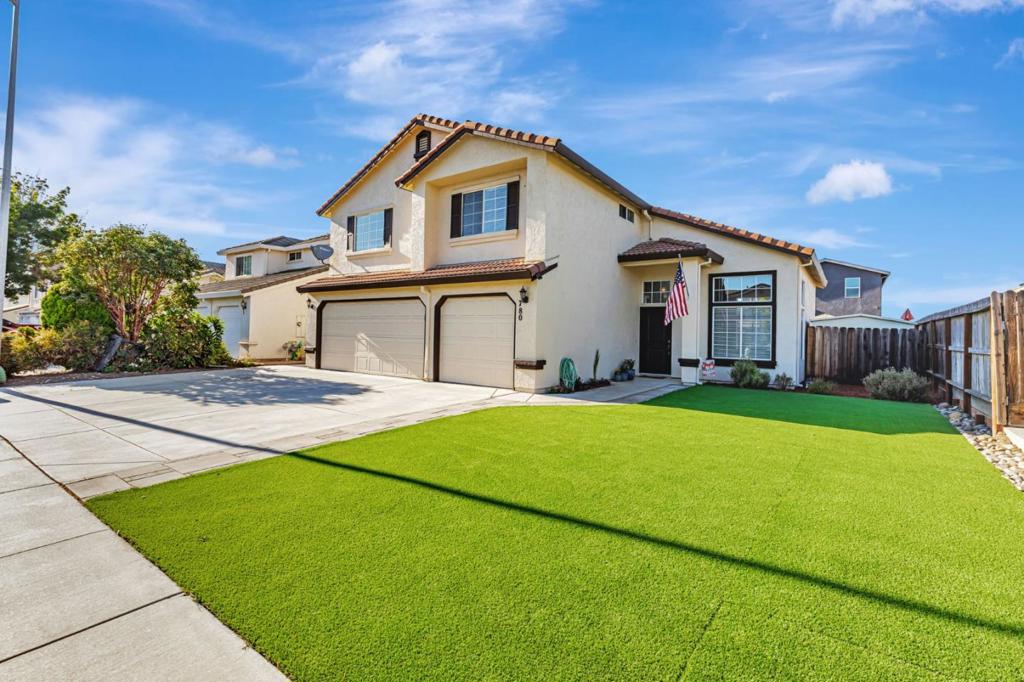 Spacious Contemporary Hollister Home - This low maintenance, drought resistant 4 bedroom & 2 1/2 bath home has approx. 2227 SF of living space & is located on a 6,206 SF. The home is equipped w/solar panels & water saving artificial turf in the front and rear yard. The interior boasts fresh paint, high ceilings, double pane windows, ground floor office/den, ground floor half bath, family room/kitchen combination w/wood burning fireplace & updated kitchen. The updated kitchen features Corian countertops, stainless steel appliances, hardwood floors, ceiling fan, and natural light from the rear yard facing kitchen window. The main bedroom suite is located on the second floor & has high ceilings, two closets w/mirrored closet doors, a walk-in closet w/organizer, updated bath w/soaking tub and stall shower & double sinks. There is an updated shared hall bath that services the three additional spacious bedrooms located on the second floor. The home also features central forced A/C for the hotter summer days and forced air gas heat for those cooler winter days. The three car garage and spacious driveway has plenty of room to park your vehicle's & provides extra storage for hobby's or toys. Fall in love with this home & put roots down in this wonderful community today!
