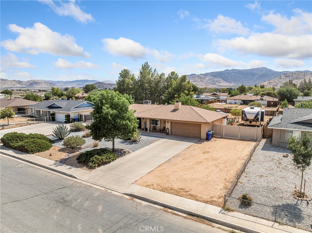 ***Charming 3 Bedroom, 2 Bath Home on Expansive 18,000 Sq Ft Lot with RV Parking!***
Welcome to this well-maintained gem offering comfort, space, and modern updates! Situated on a generous 18,000 sq ft lot, this 3-bedroom, 2-bath home features RV access and parking, a newer roof, and a swamp cooler for seasonal comfort. Step inside to an inviting living area with tile entry and cozy fireplace, updated kitchen with recessed lighting and deluxe waterproof vinyl flooring. Enjoy the convenience of indoor laundry with direct access to the backyard.
The bathrooms have been tastefully updated with tile flooring, and the primary suite boasts a walk-in shower. The garage is semi-finished, offering potential for additional workspace. Outside, relax under the covered patio, surrounded by a low-maintenance drip system, a shed for extra storage, and a lovely gazebo — all included!
Perfect for first-time buyers or those looking to downsize with room to grow. Don’t miss this move-in ready home with space and style!