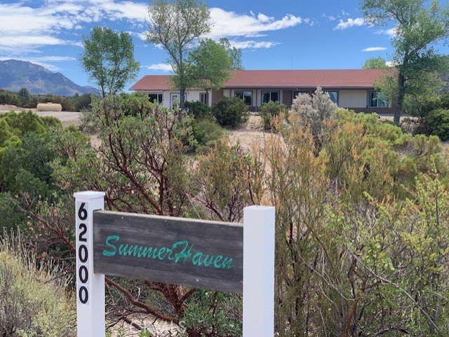 Beautiful Single Story Ranch Style Home located on 2.6 acres (2 APN's) at the end of a cul de sac with a long private drive ~
Large open great room with stone fireplace, and stunning mountain views from every window throughout the house. Newly painted exterior and interior and all new flooring ~ Spacious updated bathrooms with beautiful tile work ~ Generous storage space through out the home and in the large laundry room ~ Private and quiet in a very convenient location ~ 2 Large bedrooms, the primary has a wood burning stove and direct access to a private patio area ~ BONUS; A full guest suite with it's own private entrance ~ High Speed Fiber Optic's allow for the ultimate in connectivity for Gaming, Work from Home, Home Schooling... This very special location borders US Forestry Land offering hiking and riding trails directly from your property, with the famous Pacific Crest Trail nearby ~ Idyllwild is 25 minutes up the mountain ~ The Desert Cities 30 minutes down the mountain ~ Temecula is 50 minutes across the mountain ~ Palm Springs International Airport is apprx 50 minutes ~ Beach Cities and San Diego are apprx 90 minutes ~ Total acreage with both APN's (577-060-020 & 577-060-019) is 2.6 acres), to be sold together
