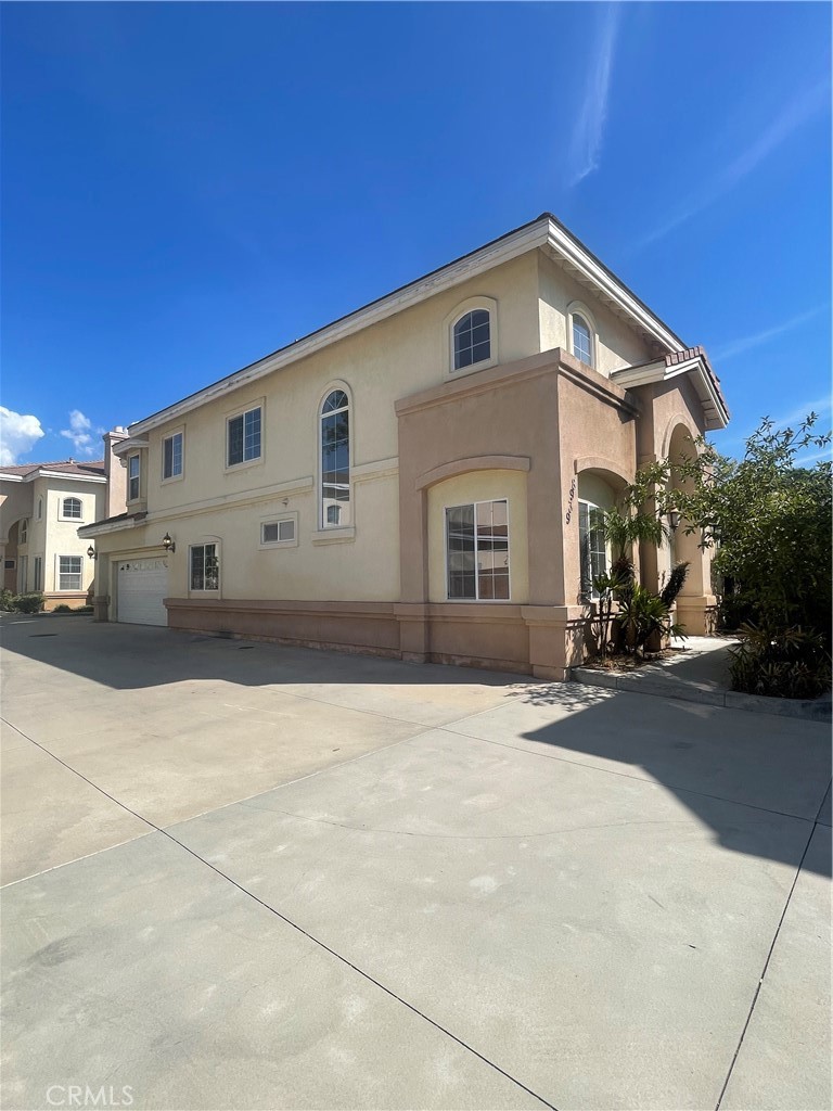 Location! Location! This detached townhome is located in north San Gabriel in the award-winning Temple City school district, walking distance to Emperor Elementary School, Oak Avenue Intermediate School, and Temple City High School. The majestic double doors lead to a spacious living room area with 9 foot high ceilings ceilings with crown molding. Freshly painted interior and new laminate floors (stairs & 2nd floor). One bed and one full bath located downstairs, great for the elderly. Large kitchen area with maple cabinets and granite countertops next to a spacious and cozy dining area. Stairs lead up to a 2nd floor loft/play area. 3 bedrooms and 2 additional full baths including the master suite. Master suite includes a walk-in closet, fireplace, and jacuzzi tub in the bathroom. Central air/heating. 2-car attached garage with direct access to the home's interior. Landscaped yard with a large private back yard. Guest parking area available. Welcome Home!