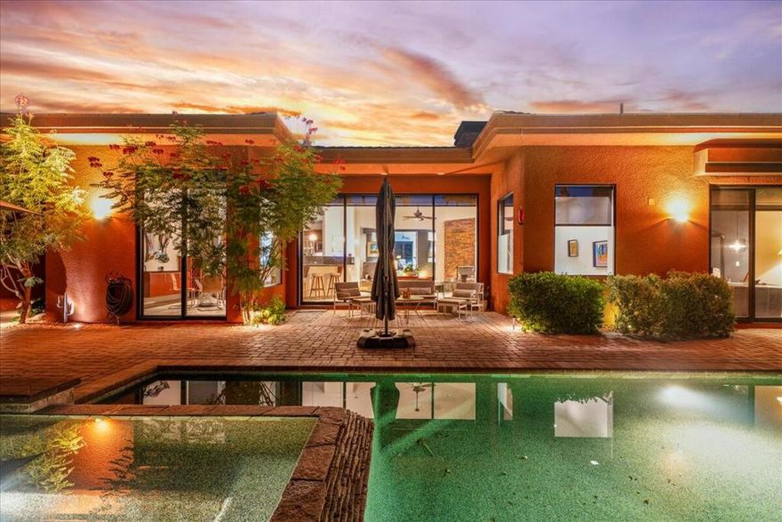 Elegant & ExclusiveStep into refined desert elegance at 50325 Via Amante, a stunning Palmilla retreat that defines luxury living in La Quinta.This exceptional single-story contemporary home with a detached casita, perfectly blends modern design with the serenity of resort-style surroundings.Step through the grand entryway into a dramatic Great Room with soaring ceilings and floor-to-ceiling pocket glass doors that seamlessly frame breathtaking views and lead to the backyard retreat. The open-concept design connects the living, dining, and chef's kitchen areas, enhanced by custom slate floors and refined designer finishes.The gourmet kitchen is beautifully appointed with granite countertops, a spacious island, double ovens, and premium appliances.  A sleek wet bar off the Great Room enhances the home's entertainment appeal, while a private office or study behind double doors provides the perfect space to work or unwind in quiet comfort.The primary suite is a true sanctuary, offering a sitting area overlooking the pool, two walk-in closets, and a luxurious spa-style bath with dual vanities, a soaking tub, and a glass-enclosed stone shower. Two additional guest suites and a detached casita each offer their own ensuite baths--perfect for hosting family or friends with style and privacy.Outside, the home becomes a true desert oasis. Enjoy a saltwater Pebble Tec pool with cascading water features, a stacked-stone spa, multiple lounging and dining areas, and a built-in BBQ/outdoor kitchen. Expansive glass doors allow for effortless indoor-outdoor living, while motorized shades provide easy control over light and privacy.Located within Palmilla's 24-hour guard-gated enclave, residents enjoy both peace of mind and convenience--just minutes from La Quinta's world-class golf courses, hiking trails, fine dining, and resort destinations.With its elegant design, thoughtful floor plan, and exceptional setting, this home stands out as a perfect blend of style, comfort, and desert sophistication. Don't miss your opportunity to own one of Palmilla's finest properties.