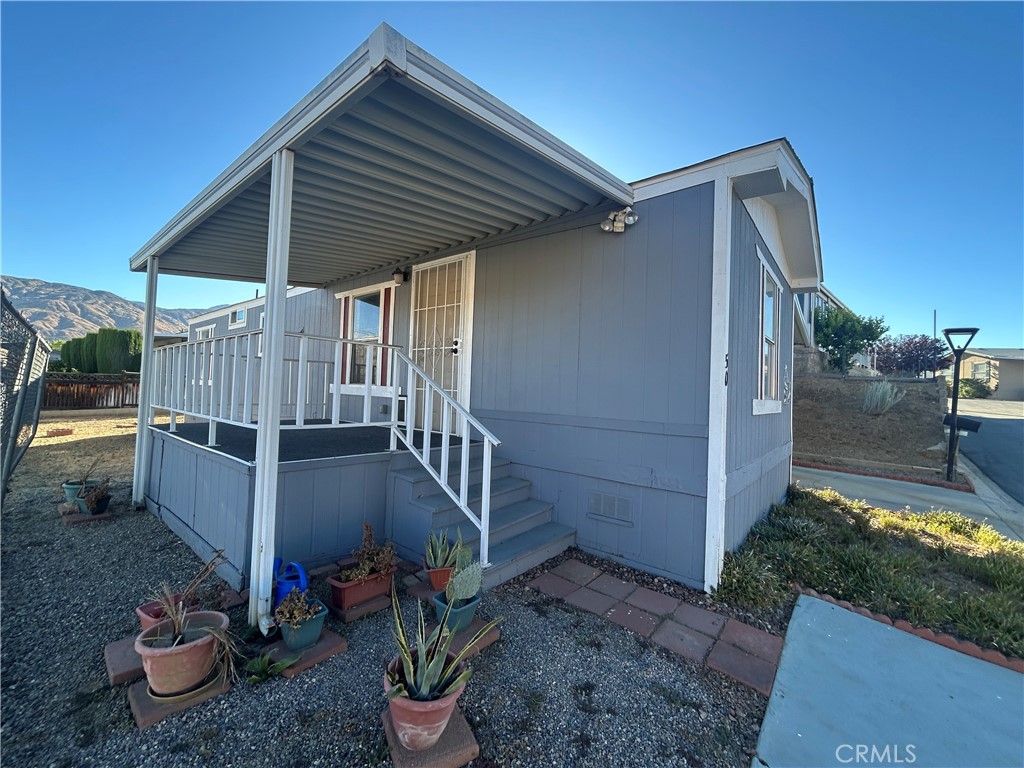 Best location and phenomenal backdrop scenery view at your back porch. Best unit location in the park! Welcome to the peaceful, serene El Dorado Palms Mobile Home Estates. A 55+ Community. Nestled among scenic mountain ranges and very close to Yucaipa Regional Park and Yucaipa Community Center. Close proximity to amenities and grocery shops. Enjoy the privacy of no rear neighbor. Completely remodeled throughout. Brand new, waterproof luxury vinyl flooring. Fresh paint, tastefully upgraded throughout. This 2 bedroom-1 bathroom home provides cozy living floorplan. Inside laundry area, appliances included, central AC. Spacious Backyard Storage shed included. This is a relaxed living with an active community program, clubhouse with social activities. AGGRESSIVELY PRICED BELOW RECENTY SOLD COMPARABLES, Motivated seller. Bring ALL offers.