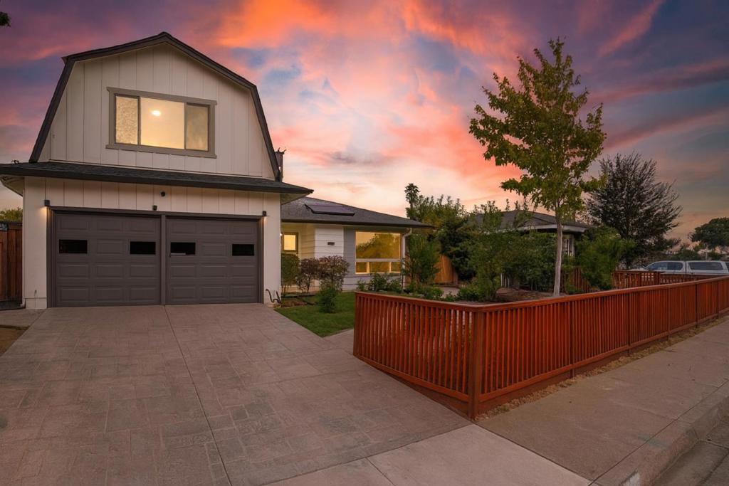 Welcome to this spacious, beautifully updated east-facing Santa Clara home featuring a permitted 1 bed + flex space / 1 bath ADU (built in 2022) with its own separate address perfect for multi-generational living, rental income, or guests. The main residence showcases a fully remodeled kitchen with stainless steel appliances, quartz counters, and a stylish hex-tile backsplash. A porcelain fireplace wall highlights the living room, while recessed lighting, three remodeled bathrooms, new flooring, a new AC system, and fresh interior and exterior paint make it truly move-in ready. Enjoy an oversized 2-car garage and two private yard areas ideal for entertaining or relaxation. Walking distance to parks, Sutter Elementary (10/10 Test Score) and Santa Clara High School (9/10 Test Score). Conveniently located near major freeways, Google and Apple campuses, Kaiser, Valley Fair, and Santana Row. Offered fully furnished with curated designer pieces and over $200K in upgrades, including a new roof and paid-off solar a home that combines modern upgrades, timeless design, and thoughtful functionality. Best of all, a portion of the sale benefits International Crisis Aid Inc., supporting life-saving efforts worldwide.