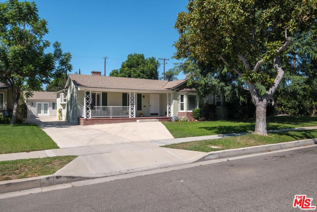 Modern Living in Burbank's Magnolia Park. This residence offers 2 bedrooms and 1.5 bathrooms in the main house, blending modern upgrades with classic style. Inside, discover hardwood floors and ample natural light from dual-pane windows. The fully renovated kitchen features stainless steel appliances and a convenient breakfast bar. There's also a dedicated dining room. Both bathrooms are tastefully updated with marble and ceramic finishes, and a decorative fireplace adds character. A versatile bonus room is perfect for a den or home office, and can easily be converted into a third bedroom. There is also a brand new, fully independent Accessory Dwelling Unit (ADU) that provides flexibility for rental income, a home office, or guest quarters. The property includes a private patio for outdoor enjoyment. Comfort is assured year-round with central air conditioning and forced air heating, plus a dedicated laundry area. All major systems in both units have been recently updated. This beautifully updated home, complete with a new ADU and prime Magnolia Park location, is move-in ready. Don't miss the opportunity to make 735 Lima Street your own.