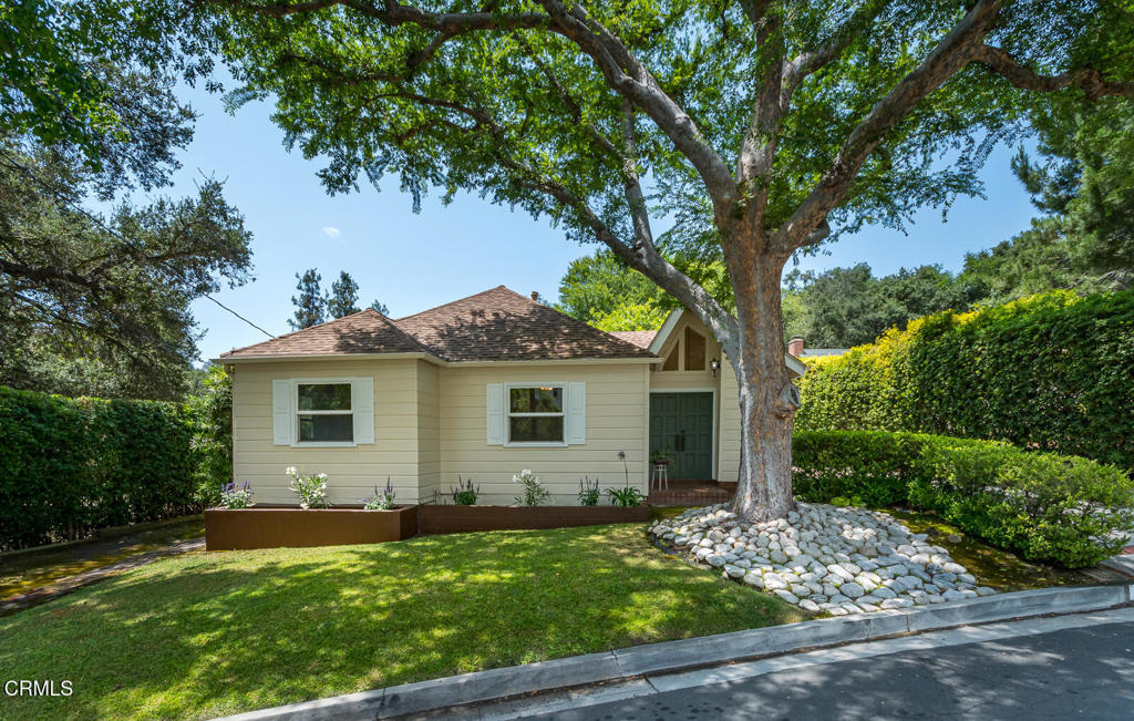 Tucked away on a peaceful cul de sac in the highly desirable Glenoaks Park neighborhood, this beautifully maintained 3-bedroom, 2-bathroom home offers 1,689 sq ft of living space on an expansive 11,226 sq ft lot. With pride of ownership since 1951, this residence has been lovingly cared for and is in true turn-key condition. Step through the double-door entry into a lovely interior featuring gorgeous wood floors, an elegant living room with fireplace, and a wall of windows that frame the picturesque garden patio. The adjacent kitchen and dining area flow seamlessly for gatherings, while a light-filled library nook provides the perfect spot to read or work. The chic primary suite, designed by famed architects Kemp and Carmichael, boasts rich redwood paneling, dual closets, high airy ceilings and private patio access for morning coffee. Two additional bedrooms, a hall bath and laundry room with ample storage complete the interior. Outdoors, the flat upper-level backyard provides a wonderful nature retreat amidst mature foliage, with plenty of room to play or relax. The two-car garage features a work bench and generous storage for added functionality. Located near Glenoaks Park, Scholl Canyon Golf & Tennis Club, and Glenoaks Elementary, with easy access to downtown LA and local studios, this is a rare opportunity to own a home that blends comfort, nature, and convenience in one of the area's most coveted neighborhoods.