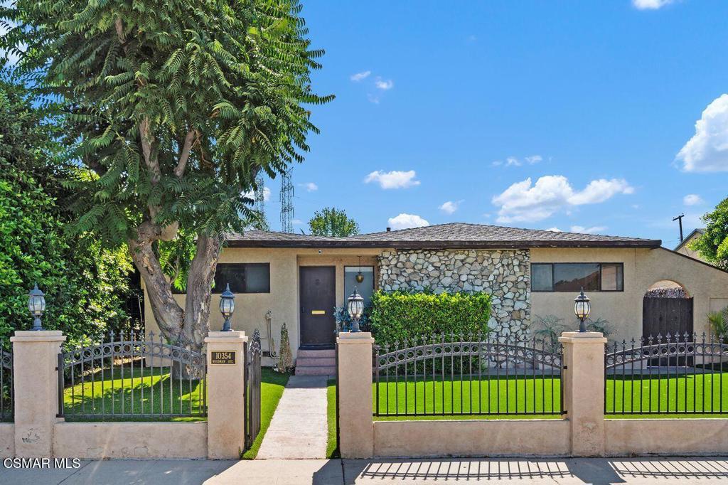 AMAZING OPPORTUNITY-Unlock the potential of this spacious one-story gem with a POOL at 10354 Woodman Ave. With 4 bedrooms and 3 bathrooms ( title shows 3 bedrooms and 2 bathrooms). Situated in a quiet area off Woodman this home offers significant space and charm. The home has beautiful curb appeal, with a gated yard and low maintenance artificial turf, giving you both privacy and a neat, welcoming appearance. The interior offers a very functional layout, with views to the pool from the main rooms. The modern kitchen offers plenty of cabinet space with some updates and looks out to the large family room. The home features wood-like flooring throughout and fresh bright light paint , giving it a clean, modern feel. The outdoor spaces are nothing short of impressive, with distinct entertaining areas. The first area boasts a fully functional teppan grill/bar area, complete with a dishwasher, mini fridges, teppan grill (included), and an elegant bar setup. Additional storage and a utility closet add practicality to this outdoor oasis. The backyard pool is ideal for summer relaxation and gatherings. Plus, a pool table entertainment room in the courtyard ensures fun times are always just a step away. Don't miss out on the opportunity to make this unique property your own and create your dream home with endless possibilities!Property is SOLD AS IS- no repairs or credits to be given by the seller.