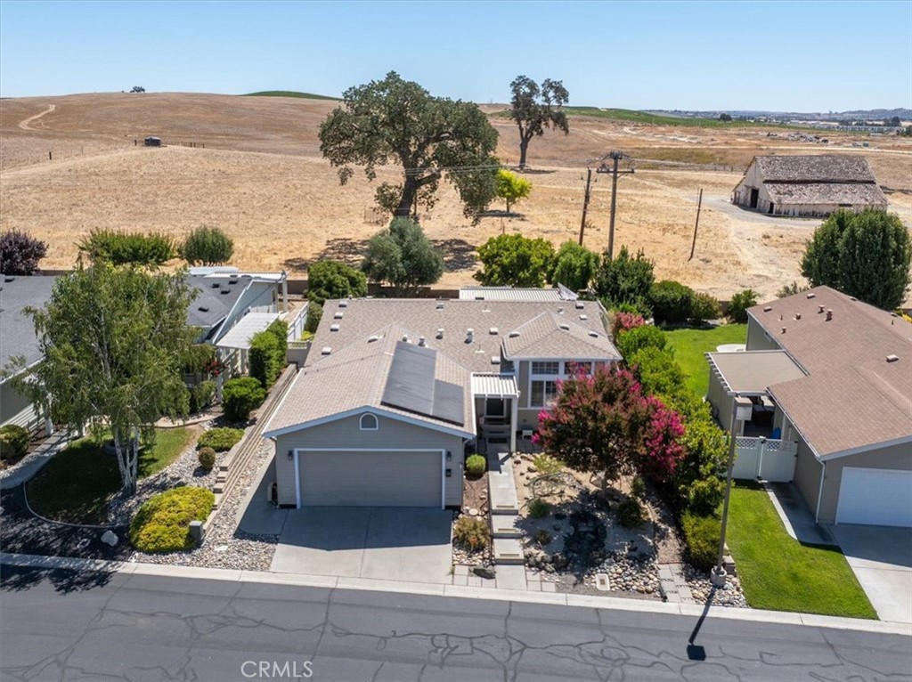 Get ready to live it up in Qual Run. Wonderful backyard garden and a covered patio to enjoy the pastoral views of the hills, the majestic Oak tree and some occasional cows. A Well-maintained home with some great touches, such as a new large window installed to look out on the back garden & open space behind the home. The kitchen was remodeled in the last 5+/- years. Beautiful flooring and some tall ceilings. Leased new SunRun/Tesla solar system with a back up battery for lower electric bills in those warm summers. The home boasts an open kitchen to living room/dining area floor plan and a separate front family room. Fully landscaped with easy maintenance front yard and irrigated back garden with a raised planting bed. The roof is 6+/- years old and there are new upgraded screen doors in front and back. Quail Run is 55+ gated development popular for its community amenities, such as the pool/spa, pickle ball court and the clubhouse, which has plenty of activities to participate in. All Ready for you to move in and enjoy!