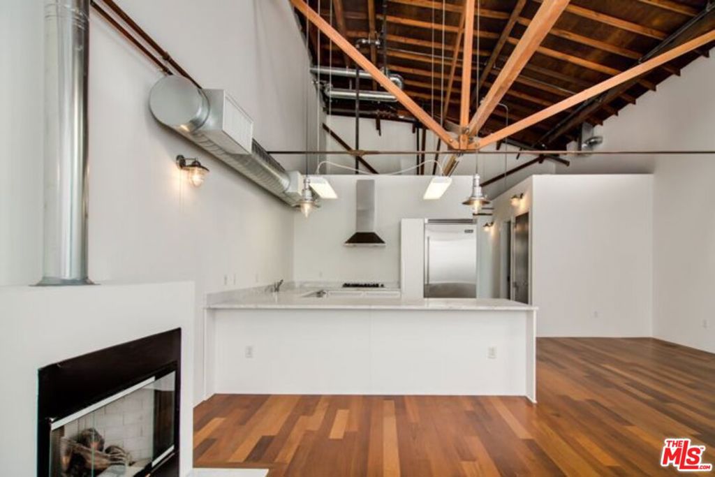 Classic Architectural Warehouse Loft in Prime Location! Open floor plan with soaring ceilings and wood floors and industrial details. Chef's kitchen features stainless steel appliances and marble countertops. Historic factory building has been fully rehabbed while maintaining authentic character. This bright live/work space includes in-unit laundry with Bosch washer/dryer, spacious bedrooms with balcony, and flexible layout for creative use. Conveniently located near the beach, Abbot Kinney, restaurants, and all the activity of the Marina Arts District. Ready for immediate move-in.
