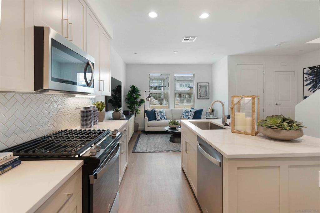 Welcome to Stirling at Cota Vera, a collection of upscale rental townhomes in Chula Vista where space, seclusion and convenience converge. Set across from Central Square Park, these two-story? 1-2 and 3-bedroom homes offer the feel of ownership without the maintenance. Generous floor plans may include flex rooms, powder rooms or lofts. Interiors showcase quartz countertops, designer cabinets, kitchen islands, stainless appliances and recessed lighting atop wood-look plank flooring. Smart door locks and thermostats, keyless entry, direct-entry garages with EV-charging, in-home washers and dryers and ample storage ensure everyday comfort. Outside, a resort-style pool and spa, two-story clubhouse with ocean-view terrace, fitness and yoga/spin studios, coworking space and demonstration kitchen anchor a social scene. Residents also enjoy gaming lawns, multiple playgrounds, open fields, a fire pit and pet-friendly perks like a dog park and pet wash. Solar-powered benefits, community-wide Wi-Fi and a location near top-rated schools complete this Otay Ranch address. Close to concerts and farmers markets, stroll to future shops, stretch in the yoga studio, work from the coworking space, or gather around the fire pit. This community encourages togetherness, whether your day revolves around the pool or exploring the wider Cota Vera neighborhood. At Stirling, you belong to something bigger than your typical townhome community. Experience a lifestyle where privacy, luxury and connection come together in the heart of Otay Ranch at home!