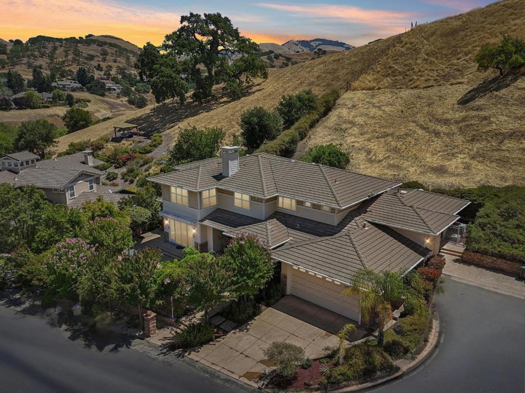 Tucked away on a premier cul-de-sac in one of Alamos most sought-after neighborhoods, 125 Mystic Place is a grand, move-in-ready estate offering 4,661 square feet of refined living space on approximately 1.67 acres of serene, landscaped grounds. Built in 2002 and thoughtfully updated with new interior paint, fresh landscaping, and plush new carpet, this five-bedroom, four-and-a-half-bathroom residence blends timeless elegance with modern comfort. The expansive floor plan features formal and casual living spaces, ideal for multigenerational living or hosting large gatherings, plus an additional home office which offers the perfect work from home setting. Multiple outdoor areas provide room to entertain, garden, or relax in total privacy, with ample space for a pool or future additions. Located in the rolling hills of Alamo, a prestigious community known for its natural beauty and suburban charm, this home is just minutes from Las Trampas Regional Wilderness, top-rated schools including Alamo Elementary, Stone Valley Middle, and Monte Vista High, and the conveniences of downtown shopping, dining, and freeway access. With its prime location, estate-scale lot, and tasteful upgrades, this home offers luxury and long-term value in one of Contra Costa's most desirable enclaves.