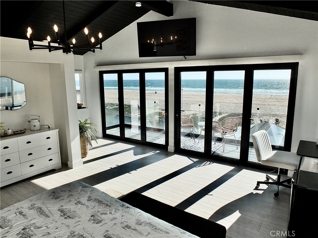 ENJOY LIFE in this architecturally stunning, oceanfront property in exclusive Sunset Beach. This extensively modernized property is just waiting for you to bring your essentials, open the door, and LIVE the DREAM! Highlights of this three-story gem on the sand include sweeping ocean & coastline views from the exclusive top-floor primary en-suite RETREAT, boasting beamed, cathedral ceilings, a wall of modern glass doors to showcase the private, full-length glass balcony with unobstructed ocean views, a large closet, a luxurious, spa themed, en-suite bathroom with a double shower & sunken bath, dual sinks, office nook, and coffee bar. The second floor has a spacious bedroom / guest quarters. The first floor FEELS LIKE HOME with a fabulous modern wood entry door, beachy hardwood floors, a well-outfitted kitchen that opens to the living room, and a dining area with large glass sliders that bring in ocean breezes and sounds, extending gatherings to the intimate rear patio.
ENJOY all of the al fresco luxuries of living on the coast; a large front shared deck on the sand for entertaining, with plenty of seating, spa & grille, the beach for entertaining or enjoying your solitude and all while taking in the panoramic views of nearby Catalina Island and the coastal city lights. There's a clean, one-car garage with washer & dryer and storage space, as well as a second garage with bicycles and standing video games for your enjoyment. Come in from the ocean and sand to a modern outdoor shower en route to your front entry. This crisp and clean home sleeps 6 comfortably! SAY "YES" to this fully furnished, instantly comfortable, upscale property with flexible rental periods from 31 days to a Year or more! It’s a perfect spot for extended stays for families, working professionals, or anyone wanting to enjoy the sound of crashing waves, warm ocean breezes, walks on the beach, walkable local bars and restaurants including Captain Jack's, and breathtaking sunrises and sunsets! Just minutes from Long Beach and Orange County airports, business hubs, and medical centers. Flexible lease options are available. Call for leasing details. “Bring Your Lifestyle Home!”.