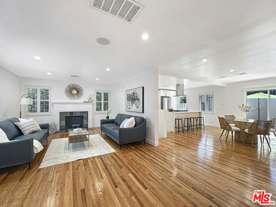 Welcome to this stunning modern traditional residence featuring a Lower Level JR ADU, PLUS a DETACHED GUEST HOUSE in the highly sought after View Park Neighborhood. This home is perfect for multi-generational living or the savvy end user looking to produce additional rental income. Situated on a serene tree-lined street, the main residence features 2bd2ba 1158sf, lower level Jr ADU features Studio/1ba 329sf, and Detached upper 2-level ADU features 1bd/1ba 498sf, plus bonus 229 sf Roof Top Deck! Step up to the main entry, and into the open floorplan featuring brand new hardwood floors, peaceful sky and treelined views, plantation shutters on dual pane windows, and decorative fireplace. Sunlight pours out natural light and positive vibes throughout the home, creating a dazzling masterpiece. Perfect open concept living/dining/kitchen floorplan with kitchen and patio door leading to the outdoor patio, perfect for Alfresco dining. Two car garage with convenient direct access into the main residence. Master bedroom features a luxurious ensuite with door leading to the backyard patio. Central hvac, recess lighting, and surveillance cameras. Jr ADU is street level with its own private entry separate from the Main residence featuring a cozy studio with full bathroom, kitchen, its own laundry hookups, mini split system, and outdoor patio. Wait, it gets even better! There is a newly constructed (2025) guest house completely detached and separate from the main residence. Situated on the elevated backyard with retaining wall, features a private 1bd1ba home with a bonus rooftop deck capturing incredible skyline views. The guest house is fully equipped with a full kitchen, luxurious bathroom, laundry, bedroom with two closets and high ceilings. Both accessory dwellings are perfect for a home office, accommodating guests, multi-generational living, or producing lucrative rental income. View Park is one of the most distinguished neighborhoods in Los Angeles with easy access to LAX, Silicon Beach, and Downtown LA. Also located near local hotspots like Jon & Vinny's, Hilltop Coffee & Kitchen, and Somerville. Come see it while it's available!