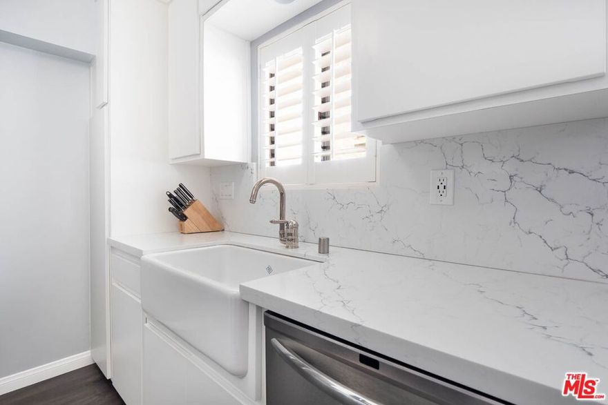 NOTE: HOME WILL BE UNFURNISHED. NEW PHOTOS COMING SOON! Welcome to your private sanctuary tucked away in a super central pocket of West LA. This two-story townhome is the perfect blend of cozy and contemporarystylish without the stuffiness, modern without losing its charm. It feels more boutique hotel than basic apartment. The bright and spacious living room invites you to kick back and relax in front of the cozy fireplace. Step through the sliding glass doors onto your breezy balconyjust the spot for morning coffee or some fresh-air journaling. The kitchen? A total showstopper! With sleek white quartz counters, a farmhouse sink, stainless steel appliances, and bright shuttered windows, it's as photogenic as it is functional. Upstairs, you'll find two spacious bedrooms with vaulted ceilings, updated flooring, and enough closet space for every season of your life. The bathrooms are spa-chic -- think soaking tub, rainfall shower head, and subway tile for days. And yep, there's in-unit laundry because we all love convenience. Whether you're entertaining, unwinding, or working from home, this place adapts to your lifestyle like a dream. You're surrounded by Brentwood, Santa Monica, and Mar Vista, with easy access to the 10 and 405, so everything you need is right nearbybut your home still feels like a peaceful retreat. Come on in and see what makes this place special. It's more than a rental. It's a vibe!