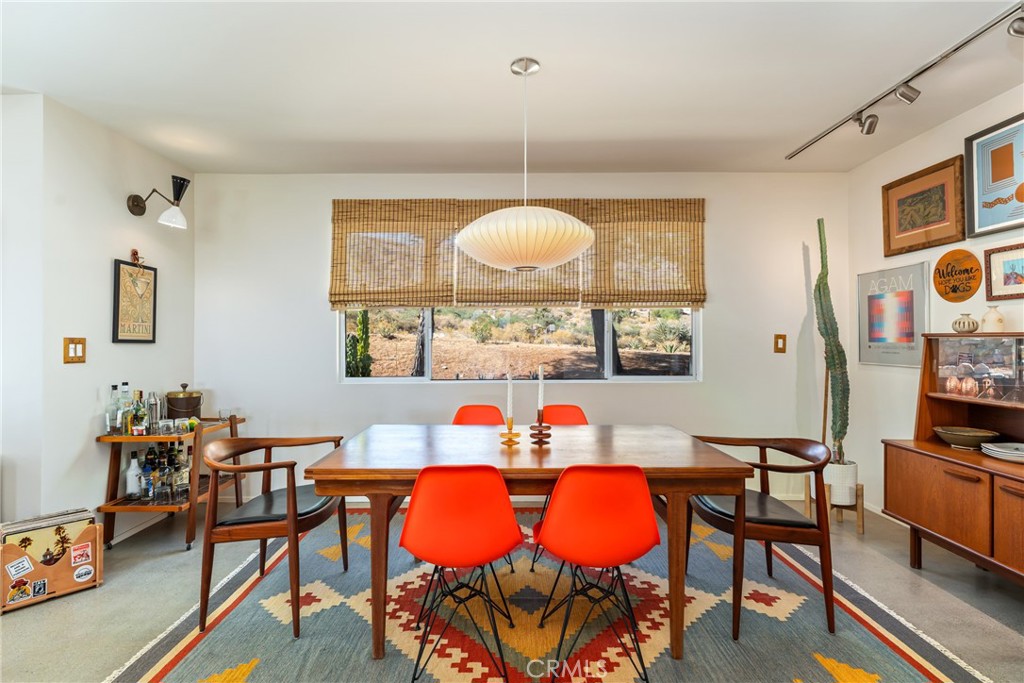 Pristine condition, meticulously curated inside and out, nothing overlooked, nothing to be done, every square inch perfection. Only the best appliances, materials, and craftsmanship. It will not need to be touched for many years to come. The perfect blend of clean, modern, and functional with the warmth and soul of real wood and vintage. Over two-acres surrounded by mature trees and cactus strategically placed for privacy while maintaining the openness and views from every direction. Three different levels of usable time-tested property, rarely found in new construction. Fully furnished with collectable authentic vintage mid-century modern furniture from Lane, Drexel, Herman Miller, George Nelson, Eames, and more. All rooms individually climate control by top-of-the-line Mitsubishi, heating and cooling ceiling cassettes. Custom hardwood cabinets. Quartz countertops, Nostalgic mid-century above ground pool. Custom premium leather couches by Arizona Leather. All new roof and fascia. Professional LED lighting inside and out. RV parking. Secure front parking with an automatic gate. Level 5 smooth coat drywall finish throughout. Premium paint inside and out. Cozy wood burning stove for those cold winters. Shipping container storage with racks. Little Morongo Heights is quietly becoming one of the desert’s most promising neighborhoods, very few homes ever hit this coveted market. Only an hour and a half drive to LA, and situated perfectly between Joshua tree and Palm Springs just 20 minutes’ drive to both, and only 5 minutes to Big Morongo Canyon Preserve. Enjoy an occasional touch of snow in the winter and significantly cooler summers at 3,000 feet elevation. Priced at just $662.00 per square foot this fully furnished high-end custom one-of-a-kind home is an opportunity not to be missed. Cannot be duplicated.