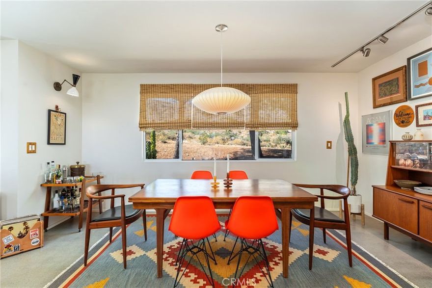 Pristine condition, meticulously curated inside and out, nothing overlooked, nothing to be done, every square inch perfection. Only the best appliances, materials, and craftsmanship. It will not need to be touched for many years to come. The perfect blend of clean, modern, and functional with the warmth and soul of real wood and vintage. Over two-acres surrounded by mature trees and cactus strategically placed for privacy while maintaining the openness and views from every direction. Three different levels of usable time-tested property, rarely found in new construction. Fully furnished with collectable authentic vintage mid-century modern furniture from Lane, Drexel, Herman Miller, George Nelson, Eames, and more. All rooms individually climate control by top-of-the-line Mitsubishi, heating and cooling ceiling cassettes. Custom hardwood cabinets. Quartz countertops, Nostalgic mid-century above ground pool. Custom premium leather couches by Arizona Leather. All new roof and fascia. Professional LED lighting inside and out. RV parking. Secure front parking with an automatic gate. Level 5 smooth coat drywall finish throughout. Premium paint inside and out. Cozy wood burning stove for those cold winters. Shipping container storage with racks. Little Morongo Heights is quietly becoming one of the desert’s most promising neighborhoods, very few homes ever hit this coveted market. Only an hour and a half drive to LA, and situated perfectly between Joshua tree and Palm Springs just 20 minutes’ drive to both, and only 5 minutes to Big Morongo Canyon Preserve. Enjoy an occasional touch of snow in the winter and significantly cooler summers at 3,000 feet elevation. Priced at just $637.00 per square foot this fully furnished high-end custom one-of-a-kind home is an opportunity not to be missed. Cannot be duplicated.