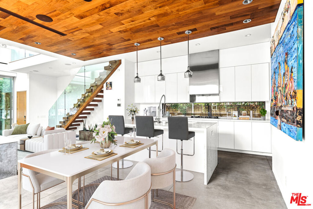 Architectural Masterpiece on Iconic Rialto Avenue: Discover this extraordinary single-family home, an architectural gem perfectly positioned on one of Venice's most coveted streets. Designed to embrace California's quintessential indoor-outdoor lifestyle, the residence offers soaring ceilings, gallery-style art walls, and a seamless open flow that extends to multiple outdoor living spaces. With three bedrooms and five baths, the home is both functional and inspiring. The exceptionally designed primary suite features a spa-like bath, leading directly to an outdoor retreat complete with a fireplace intimate sanctuary that sets this property apart. Expansive rooftop balconies provide additional space to relax or entertain, while a loft-style office overlooking the great room creates a dramatic and inspiring workspace. An oversized garage includes an EV car-charger and additional parking ensures convenience, while every finish throughout the home reflects a level of care, sophistication, and craftsmanship sought after in Venice. This is more than a residence's a statement of design and lifestyle in a prime location just moments from the beach and Abbot Kinney