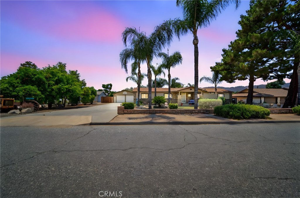 Welcome to 22135 Grove Road, a unique opportunity in the heart of Wildomar offering space, privacy, and endless potential. Situated on nearly half an acre, this 2,200 sq ft home features 4 spacious bedrooms, 3 bathrooms, and a rare 6-car detached garage—perfect for car enthusiasts, small business owners, or anyone needing serious storage or workshop space. The expansive lot provides ample room for, gardening, animal keeping, or even future additions like a pool or guest house. Located in a quiet, established neighborhood with wide streets and no HOA, you’ll enjoy the freedom to make this property truly your own. Just minutes from the 15 Freeway, local shopping, dining, and outdoor recreation areas like Canyon Lake and the Santa Rosa Plateau, this is a perfect blend of country feel and city convenience. Whether you're looking to create a family compound or simply enjoy some extra breathing room, 22135 Grove Road is a property with room to grow!