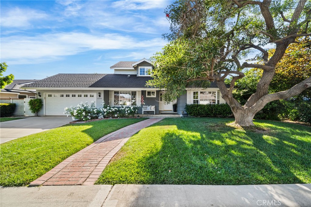Welcome to this beautifully maintained Cape Cod–style home, where pride of ownership is evident at every turn. Nestled in a quiet, tree-lined neighborhood in Tustin, this charming 3-bedroom, 2.5-bath residence offers timeless appeal, thoughtful updates, and a well-designed layout—perfect for both everyday living and entertaining. Inside, you'll find original hardwood floors throughout most of the main living spaces and bedrooms. The house is 2122 sq ft with an additional 200 sq ft unpermitted laundry room. The spacious floor plan features a bright and airy living room and formal dining room with peaceful front yard views, a convenient powder bath, and a cozy family room with a fireplace that opens seamlessly to the backyard retreat. The updated kitchen showcases modern finishes, ceramic tile, generous storage, and an inviting breakfast nook filled with natural light. Step outside and discover an entertainer’s paradise: a large covered patio overlooks a sparkling pool and spa, all surrounded by mature shade trees and a beautifully manicured lawn—perfect for gatherings, summer BBQs, kids' play, or quiet relaxation. Additional highlights include Milgard vinyl windows, an attached 2-car garage, and a versatile 200 sq. ft. unpermitted laundry/storage room for added convenience. Upstairs, all three bedrooms are generously sized and filled with natural light, while the bathrooms have been tastefully updated with quality finishes. With standout curb appeal, warm interior spaces, and an unbeatable location, this home is just a short walk to top-rated Tustin schools—Loma Vista Elementary, Hewes Middle School, and Foothill High School. Don’t miss this rare opportunity to own a truly special home in one of Tustin’s most sought-after neighborhoods. Welcome home!