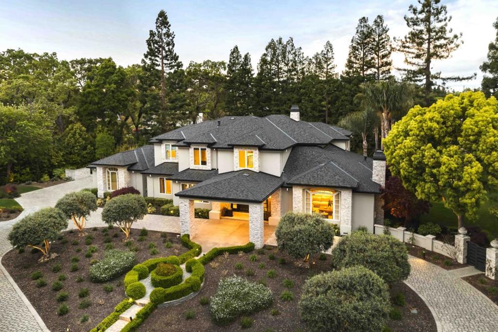 Magnificent estate nestled on 1+ AC prestigious West Atherton. Past the gated motor court awaits a 6-bedroom residence that has been meticulously upgraded and remodeled with top-of-the-line craftsmanship and materials, with nearly 7,400 total sf of space. Multi-level floorplan radiates style and convenience while offering expansive formal rooms, a chef-worthy kitchen, a full bar in the family room, an office, rec room, and wine cellar. Each bedroom is en suite, with the primary suite providing a fireplace and spa-inspired bathroom. The grounds offer a 5-star resort experience, complete with an outdoor kitchen, pool, and more, complemented by a pool house featuring a bathroom and kitchen. Tucked away at the end of a cul-de-sac, this estate provides privacy while being conveniently located near everything the surrounding area has to offer, from downtown Menlo Park and Palo Alto, to Stanford University, Menlo Circus Club, top public and private schools, and 2 international airports.