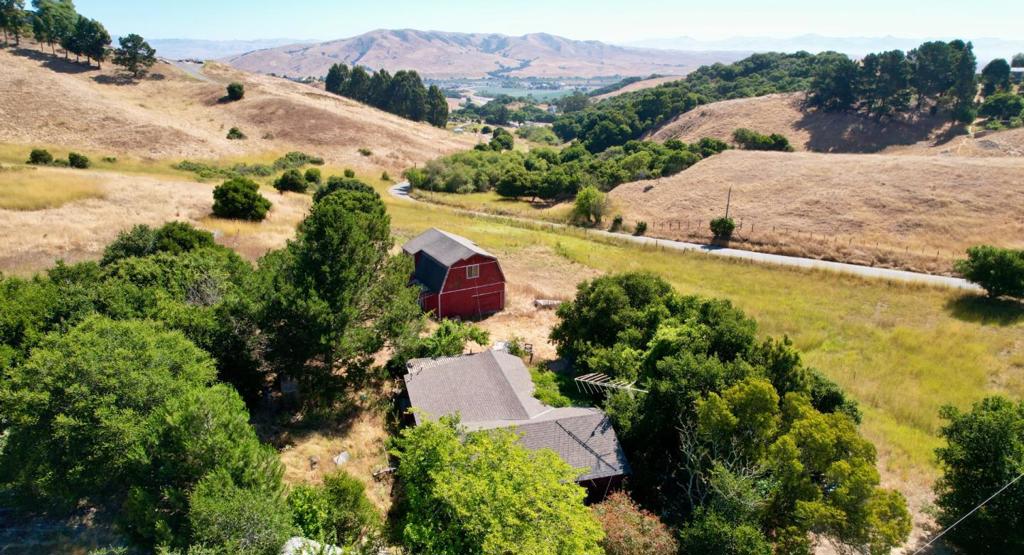 This expansive horse property spans 12.5 acres of picturesque countryside in charming San Juan Bautista, with a spacious two-level barn that provides ample storage and the potential to be converted into an accessory dwelling unit. While the 3 bedroom, 1 bath home needs major TLC, this lot presents a unique opportunity for expansion or investment because it can be subdivided. Buyers are advised to check with the county for zoning regulations or restrictions. Conveniently accessible with easy connections to Fwy 101 and Hwy 129, quick trips to Monterey and other surrounding locales are a breeze. Whether you're seeking a serene country retreat, a horse property, or considering investment opportunities, 1110 Merrill Road promises a wealth of possibilities. It's your time to own and delight in the space, privacy, and views of San Juan Bautista's hills. Horse enthusiasts will find this property especially appealing with room to roam and neighbors who appreciate equine. Prof photos soon.