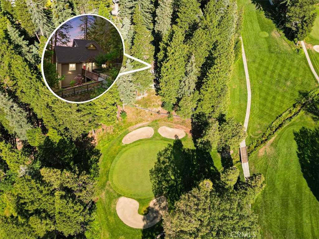 Golf Course Frontage at an Amazing Price!
Located on the 14th hole of the Lake Arrowhead Country Club with lake rights, this exceptional home offers stunning, serene views of the tree-lined golf course. Complete with a golf cart and golf cart garage! The meticulously maintained grounds feature two covered parking spaces. Inside, the near-level entry opens to a grand vaulted ceiling living room, seamlessly connected to an open-concept kitchen and dining area—all with picturesque golf course vistas. Step outside to a large deck perfect for relaxing and entertaining while enjoying scenic views. The main floor also includes two bedrooms, full bath, and laundry. Upstairs, a true master suite boasts an en-suite bathroom with walk-in steam shower, an immense walk-in wardrobe, and sweeping golf course views. The downstairs level features a second living area with large windows overlooking the course, a fourth bedroom, and full bath. Turnkey and fully furnished! Just minutes from shopping, dining, and the beautiful lake—this must-see home combines luxury, location, less than 2 hours from LA, OC and San Diego Counties!