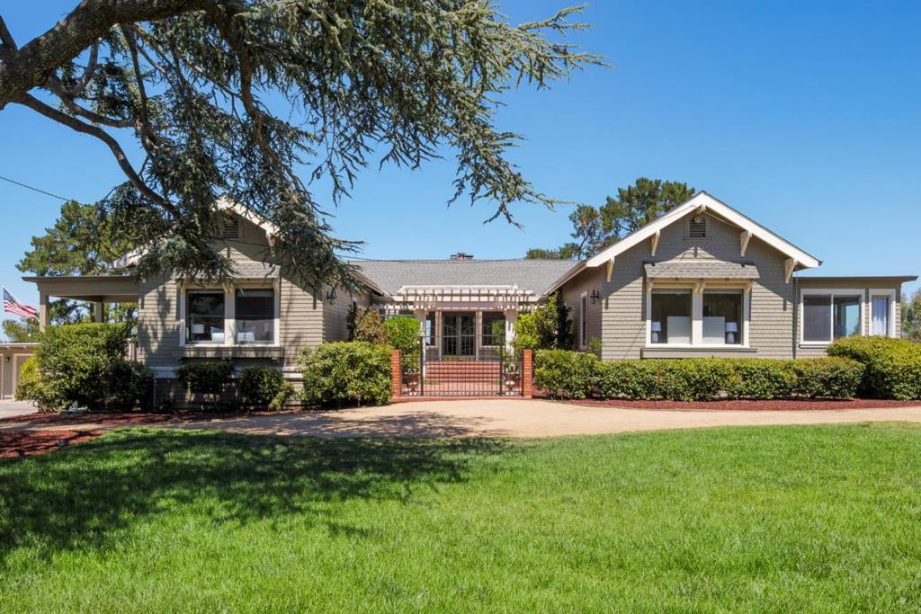 Outstanding opportunity to purchase a 1.63-acre lot with a gracious turn-of-the-century home. Located in one of Los Altos's most coveted neighborhoods, this classic residence offers timeless appeal with modern upgrades. Rich pine coffered ceilings, a remodeled kitchen, and abundant natural light define the main living areas. Three spacious bedrooms feature soaring 11-foot ceilings, including a primary suite with updated en-suite bath and light-filled office. An additional guest suite provides perfect quarters for an au-pair, extended family, or visitors. The versatile basement and garden levels are ideal for recreation, hobby, and storage needs. A detached 3-car garage and motor court offer generous parking. The grounds include a pool, tennis court, brick courtyard, sprawling lawn, and mature trees across a park-like setting. Significant unfinished land with possibilities for vineyards, orchards, and leisure. Opportunity to create a lot split, resulting in two parcels (a one-acre parcel and a .63-acre parcel), allowing a higher building density on the property or to sell one of the lots. Approvals are currently in process. Convenient to Hwy 280, Los Altos Country Club, shopping, and top-rated schools.