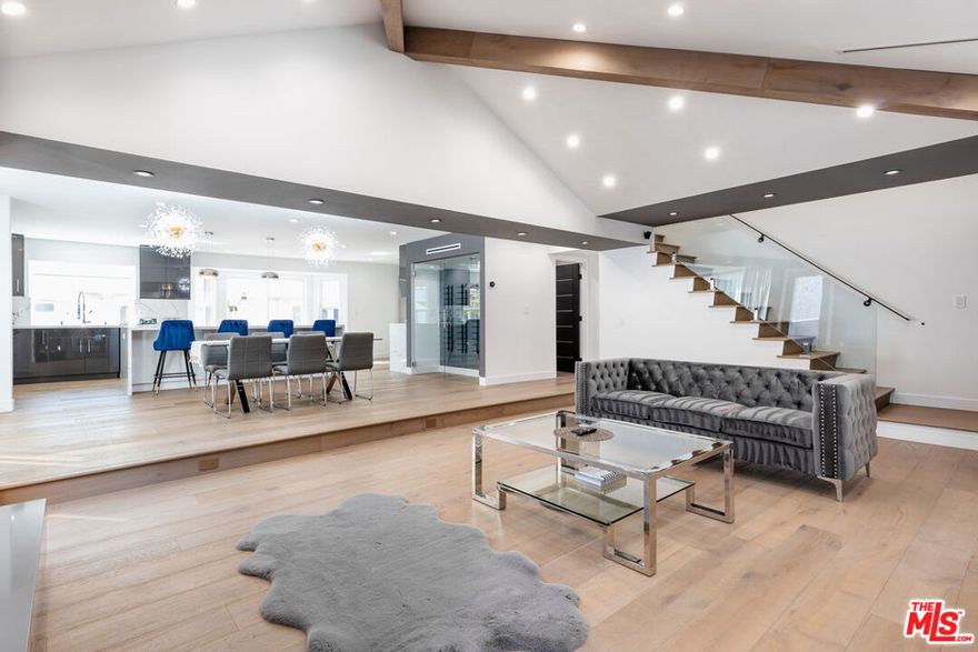 Welcome to 18721 Hatteras Street, Unit 10. A beautifully updated townhome nestled in a quiet, gated community in the heart of Tarzana. This spacious 3-bedroom, 3-bathroom fully remodeled townhome offers bright, open-concept living with high ceilings, large windows, and tasteful modern finishes throughout. Step into the inviting living room featuring high ceilings, wood flooring, and direct access to a private patio perfect for morning coffee or entertaining guests. The remodeled kitchen boasts sleek countertops, stainless steel appliances, and plenty of cabinet space, flowing seamlessly into the dining area. Upstairs, the expansive primary suite features vaulted ceilings, a walk-in closet, and a spa-like ensuite bathroom with dual vanities and a glass-enclosed shower. Two additional bedrooms provide ample space for family, guests, or a home office. Additional highlights include in-unit laundry, central HVAC, direct access to a private 2-car garage, and access to the community pool and spa. All within short distance to Ventura Blvd's shops, cafes, restaurants, and just minutes from the 101 freeway. Don't miss this rare opportunity to own a stylish, move-in ready townhome in one of Tarzana's most desirable gated communities.