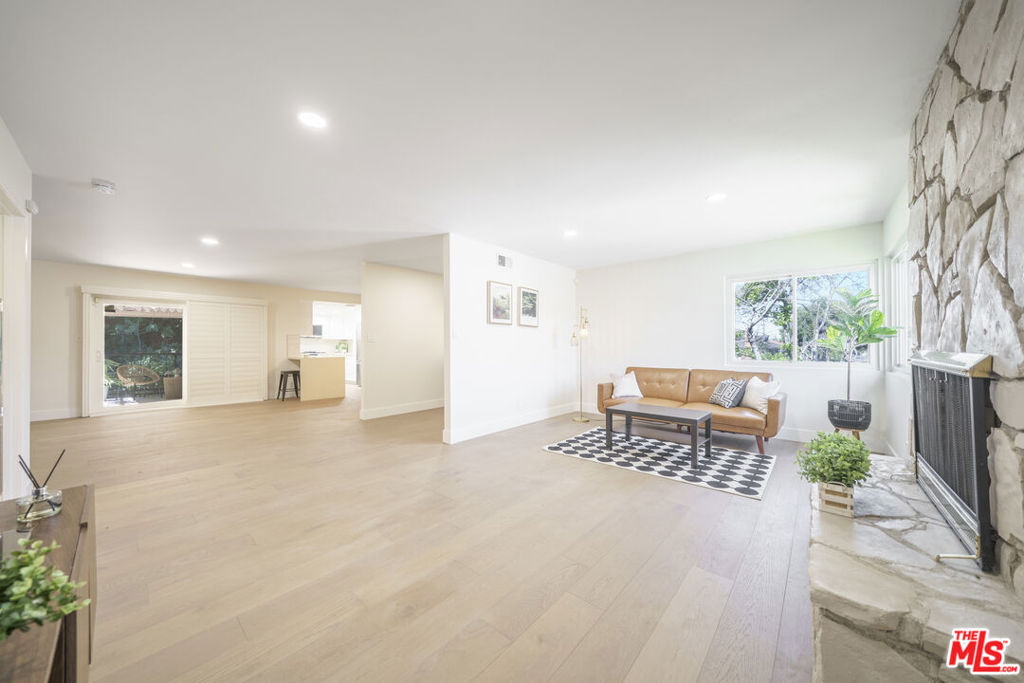 Welcome home!! This completely, meticulously and thoughtfully remodeled home is finally looking for a new owner. This corner lot house is sitting on 9k SQ.FT with lots of green and trees in the back and along the street. Brand new hardwood floor, paint inside and outside, garage door, and recessed lights through out. The kitchen is equipped with all brand new LG appliances such as oven, fridge, dishwasher and microwave. The hallway bathroom has a new tub and vanity for guest. You can invite your guests and have a BBQ party in the back yard. Circular driveway in the front. 2 car garage! New white wall was added on Cameron Ave. side for privacy and safety.