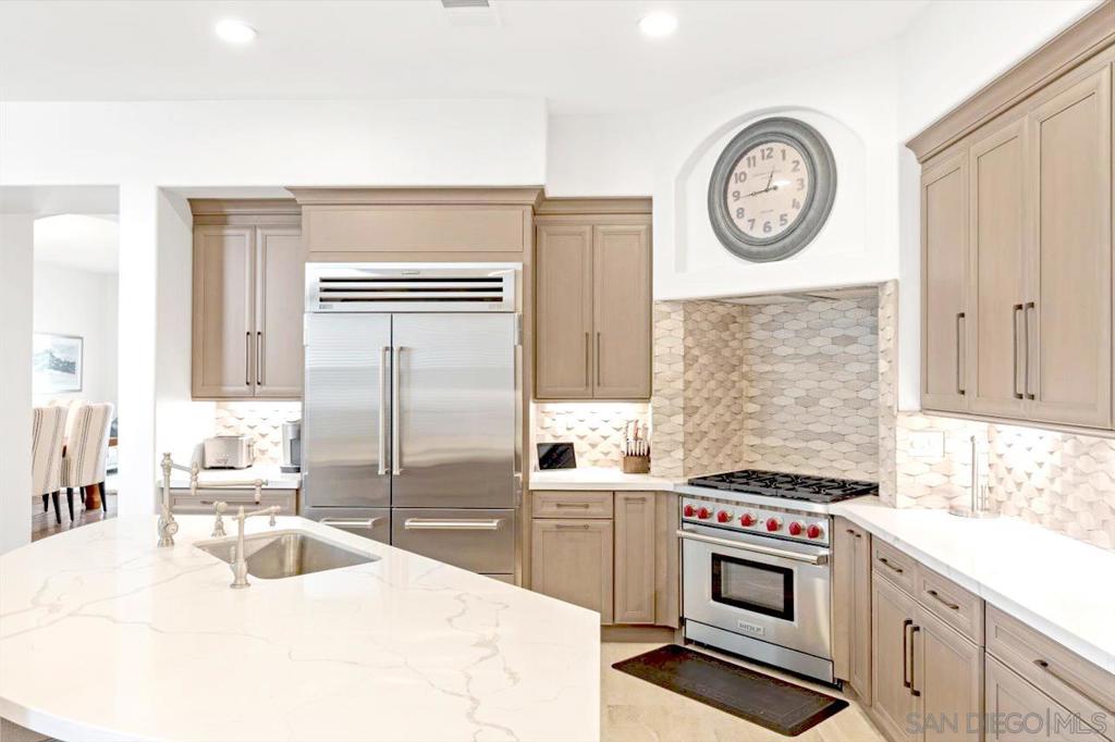 This luxury home with 2800+ sq. ft. of living space is located in the glorious community of Point Loma. Wood plank flooring spans the main living areas filled with abundant natural light. The perfect blend of crisp, sleek, and leisure. This sprawling 4 bedroom 3 bath home delivers superior indoor/outdoor living. A no expenses sparred kitchen outfitted with a Sub-Zero refrigerator, Wolf gas range, Wolf oven, and microwave. All of which opens up to the family room with a fireplace and custom-built bar alcove, hosted by two Viking wine fridges. From the kitchen and family room, double-glass doors lead you to a private fully-fenced backyard/patio with a custom, brand new Delta Grills built-in BBQ island and fridge for effortless entertaining outdoors. This posh home features a spacious bedroom and private bathroom downstairs for your convenience. Upstairs you will find an inviting living/game room for your enjoyment. Flanked with two generously-sized bedrooms at one end and an expansive sunlit master suite complete with his and her walk-in closets, dual sinks with plentiful storage, separate shower enclosure, and an oversized serene tub. This home has been modernized with usb/usb-c outlets and aesthetic details for the comfort of living and luxury. Exclusive, classy, and accessible to the stylish bars, restaurants, and boutiques of Liberty Station. Equipment: Garage Door Opener, Range/Oven Sewer: Sewer Connected Topography: LL
