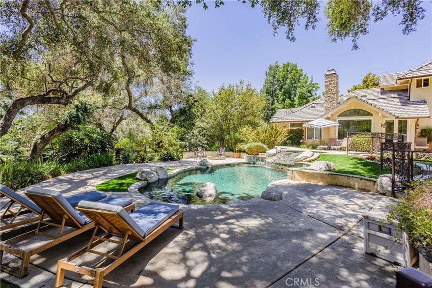 Newly listed Modern Serenity in the De Luz Hills
Welcome to your private escape in the rolling hills of De Luz—just 9 minutes from town, yet a world away. Set on over 5 acres of lush, tranquil landscape, this stunning estate seamlessly blends natural beauty with modern luxury.
The centerpiece is a recently refreshed and transformed striking 6,000 sq ft home with 5 spacious bedrooms, 5 1/2 bathrooms, thoughtfully designed for open-concept living and effortless indoor-outdoor flow. Winding stone paths lead you across charming bridges and past a gentle stream, all surrounded by lush greenery and curated landscaping that feels like your own private park illuminated by custom designed lamp posts adding to the unique charm of the property.  The grounds also boast more than a dozen citrus, avocado and fig trees ripe for seasonal picking.
Inside, sophistication meets comfort. Soaring vaulted ceilings invite in sunlight, while the chef’s kitchen is fully equipped with premium appliances: built-in refrigerator, 6-burner stove, dual dishwashers, two microwaves, and double ovens. Custom Kitchen features include sleek granite counters.
You will also find plenty of storage, walk in pantry and separate wine room. Enjoy one of the most scenic backyards in De Luz with views of the park-like setting as well as an inviting pool & spa  under the enchanted hundred year old Oak Trees. 
Need extra space? A full upstairs apartment offers the perfect setup for guests, extended family, or even an income opportunity.
And there’s more:
64-panel solar system (paid off)
Three potential water wells,
Professionally landscaped outdoor spaces ideal for entertaining or relaxing.
Ideal location with Old Town Temecula and Temecula Wine Country just minutes away, this one-of-a-kind property offers the ultimate balance of seclusion and convenience.  An absolute must see!