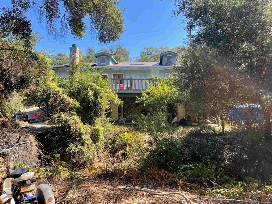 Estate sale, Animal "O" designator property with a tremendous upside! 3153 sq ft, 4 bedroom, 3 bathroom, 2-story home built in 2006 on 4.15 acres. Horse facilities, 80-90 gpm well. Located in the oak-shaded region of North Lake Wohlford Rd, just up the road from Lake Wohlford. Gently sloping usable land with 100+ old Oak trees throughout. Zoned A72 agricultural, there is so much one can do with this property. Come out to the country to get away from the hustle and bustle of the city.
