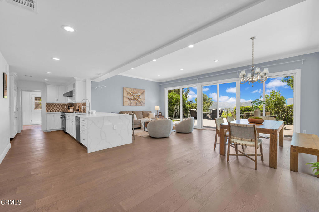 Discover this stunning, fully remodeled in 2019 home nestled in the prestigious La Canada Unified School District. Boasting 5 bedrooms and 4.5 bathrooms across 3,220 sq.ft. of thoughtfully designed living space, this home offers comfort, style, and beautiful views on an expansive 11,412 sq.ft. lot. The first floor features a spacious living room, elegant dining room, a large family room, and two kitchens--including a sleek open-concept kitchen with high-end appliances, and a separate enclosed working kitchen, ideal for entertaining and everyday living. A convenient powder room and a private guest suite complete the main level. Upstairs, you'll find four bedrooms and three bathrooms, including a luxurious primary suite with its own private balcony. Step outside to enjoy the serene backyard retreat with a view deck, patio, the view stretches over a lush green vally, with mountains rolling softly in the distance beneath a cloudless blue sky, A perfect harmony of nature and neighborhood and ample space to relax or entertain. Additional highlights include a 2-car garage, solar panels and access to HOA amenities including a huge swimming pool, tennis court, play groud, beautifully maintained green area and front yard maintenance. Perfectly location just minutes from Pasadena, Glendale, and Downtown LA