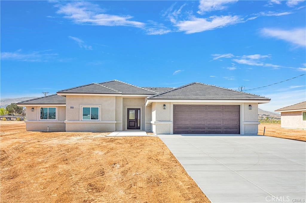 ***NEWER CONSTRUCTION HOME***Located in Sought After Location of Apple Valley, just 2 houses in off the pavement, this home is surrounded by BEAUTIFUL Mountain VIEWS**Energy Efficient, with Paid solar***Spacious & Open Concept Floorplan**4 Bedrooms, 3 Baths**Just under 1 Acre of land**