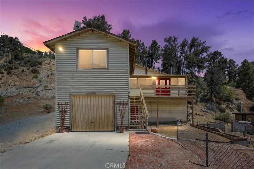 BEAUTIFUL MOUNTAIN HOME WITH VIEWS, RV PARKING & BONUS LOT; Welcome to your dream retreat in the heart of Frazier Park! This spacious two-story mountain home sits on a generous 12,062 sq ft lot and includes a second 9,154 sq ft lot across the street, offering plenty of space for RV parking, recreational vehicles, toys, or future use. Inside, the home features 3 bedrooms, 3 bathrooms, and a bright, open living space with large windows that flood the room with natural light. Enjoy cozy evenings by the fireplace and cook with ease in the comfortably sized and well laid out kitchen, featuring oak cabinetry, tile countertops, and a built-in stovetop, ideal for everyday cooking and casual entertaining. The lower level includes a one-car garage, expansive storage, and a bonus room that could serve as a 4th bedroom, guest suite, game room, or office. Step outside to a sunny upper deck, perfect for lounging during the day or stargazing at night. This is your opportunity to own a piece of peaceful mountain living with room to roam, space to park your RV, and endless potential. A must-see property, schedule your tour today!