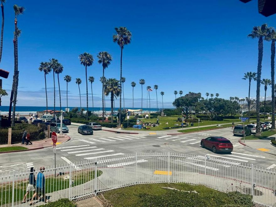 Just 114 steps from the white sands of La Jolla Shores, this bright and inviting residence offers ocean views from the living room, dining area, and primary bedroom. A large sliding glass door opens to a private balcony — the perfect spot to enjoy your morning coffee or take in a breathtaking sunset.  The home features two bedrooms, two bathrooms, and in-unit laundry for convenience. An energy-efficient split A/C system ensures year-round comfort. Located on the second floor (no elevator) in one of the most desirable beachside communities of La Jolla Shores.