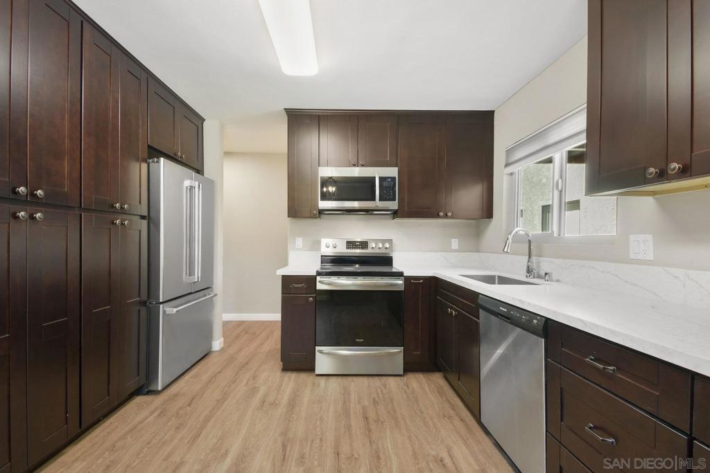 Awesome value in highly sought after location! This beautifully remodeled condo is tastefully redesigned w/ quality finishes and appliances are included! The spacious kitchen has quartz counters and all stainless appliances including washer/dryer! This well-located first level, corner unit has a private patio w/storage and is close to the assigned parking, and complex amenities. This beautiful unit is centrally located, only minutes away from SDSU, Shopping and restaurants. Also, close to beaches, ballpark and downtown!