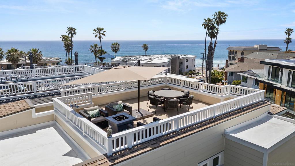 Welcome to your private coastal haven in Windansea, one of La Jolla’s most coveted beachfront neighborhoods. Just steps from the sand, this four-story retreat offers sweeping ocean views, refined interiors, and seamless indoor-outdoor living that brings the sea into every moment. Enter through the garage to find a laundry room and a serene king bedroom with walk-in closet and ensuite, ideal for guests seeking quiet privacy. Upstairs, the main level showcases ocean views from a chef’s kitchen with bar seating for seven, a dining area for eight, and a cozy living room with French doors opening to an oceanfront deck with BBQ. Also on this level is a queen bedroom with ensuite and a private view deck. The third-floor primary suite is a sanctuary with a king bed, spa-style bath, walk-in closet, vanity, and ocean-facing balcony. A guest room features a queen pull-out sofa, queen bunk bed, twin trundle, full bath, private deck, and walk-in closet. At the top, a rooftop deck offers panoramic views, firepit, lounge seating, and dining table for unforgettable evenings. Additional features include AC, heat, 2-car garage plus driveway parking, and pet-friendly accommodations. 30-night minimum stay. Sleeping Accommodations (Maximum Occupancy 12): Bedroom 1: King Bedroom 2: King Bedroom 3: Queen Bedroom 4: Twin bunk, queen sofa bed, twin trundle Five bathrooms total, including four full baths and one half bath.